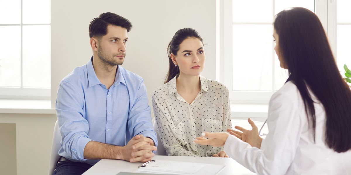 One person withdrawn while the other listens attentively — showing emotional disconnect.